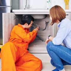 Plumber Installing Pipe