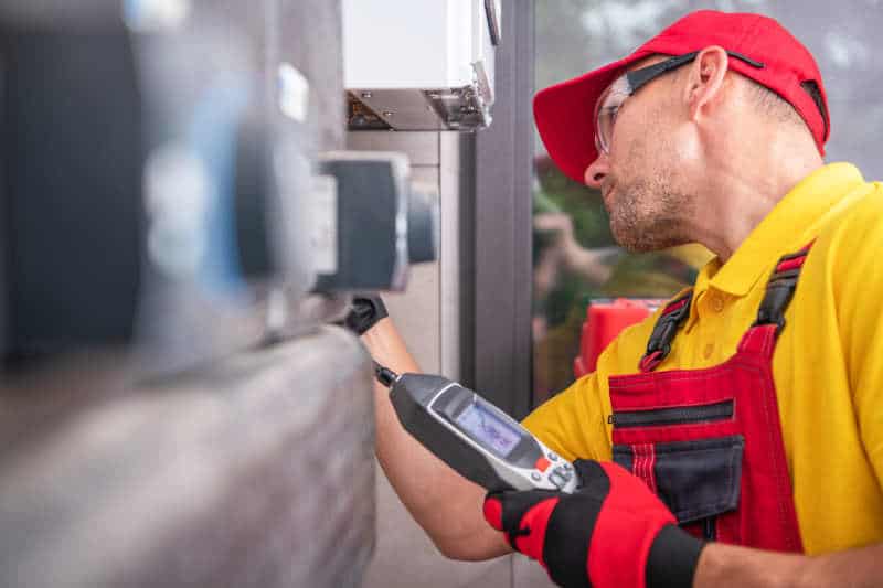 Technician is checking air conditioner